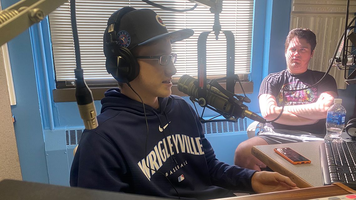 Two students chat in radio studio